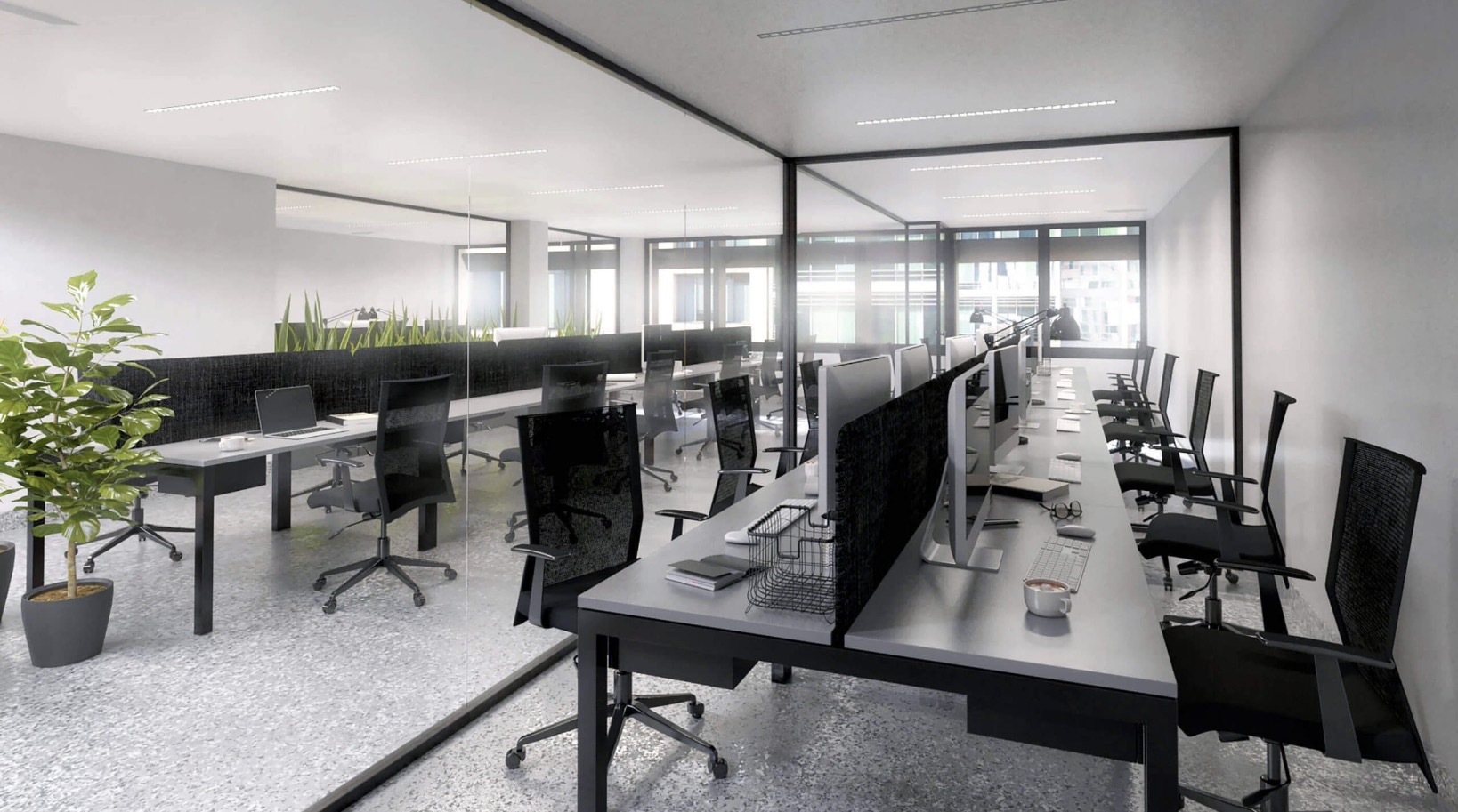Modern coworking space with desks, monitors and ergonomic office chairs